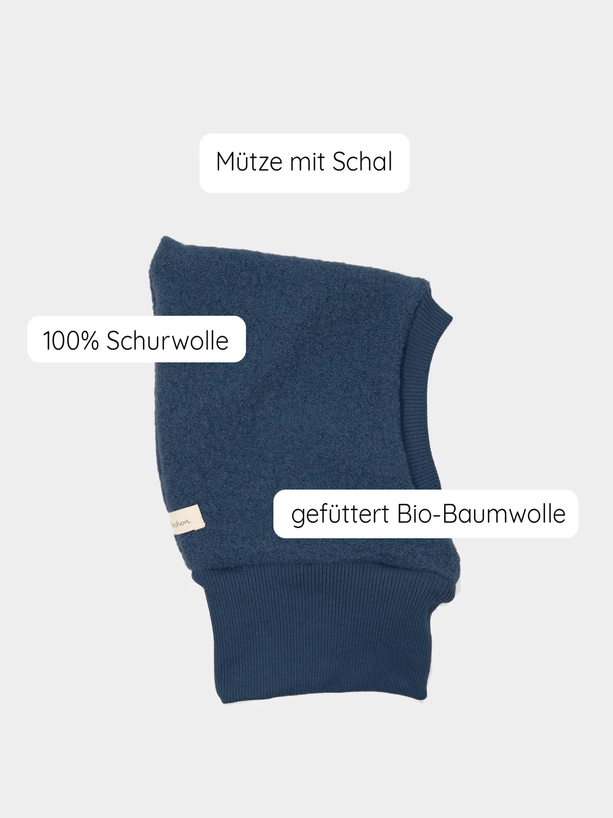 Bonnet cagoule en laine bouillie – Bleu marine : couvre-chef et tour de cou d’une seule pièce, dans un bleu denim profond, en 100 % laine vierge, doublé de coton biologique. Fabriqué à la main à Berlin, il protège parfaitement du vent et du froid.
