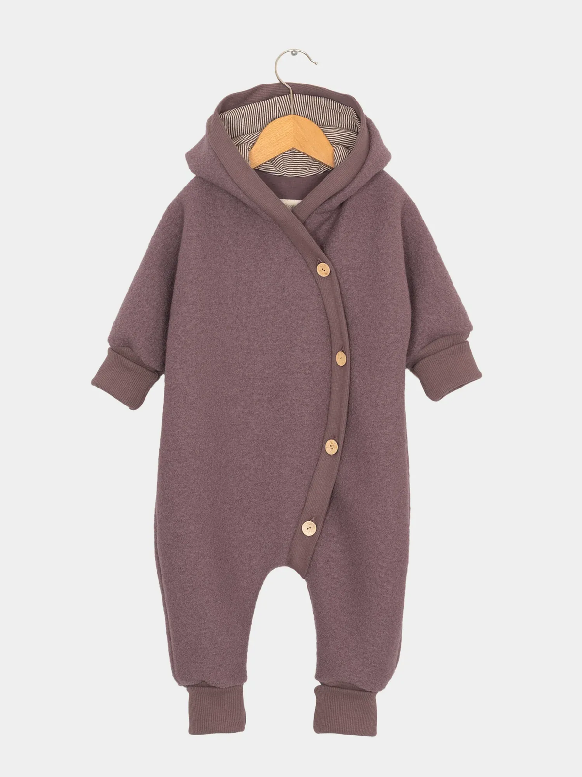Dettaglio della tutina in lana cotta Kuschelanzug - Malva, realizzata al 100% in lana vergine.
