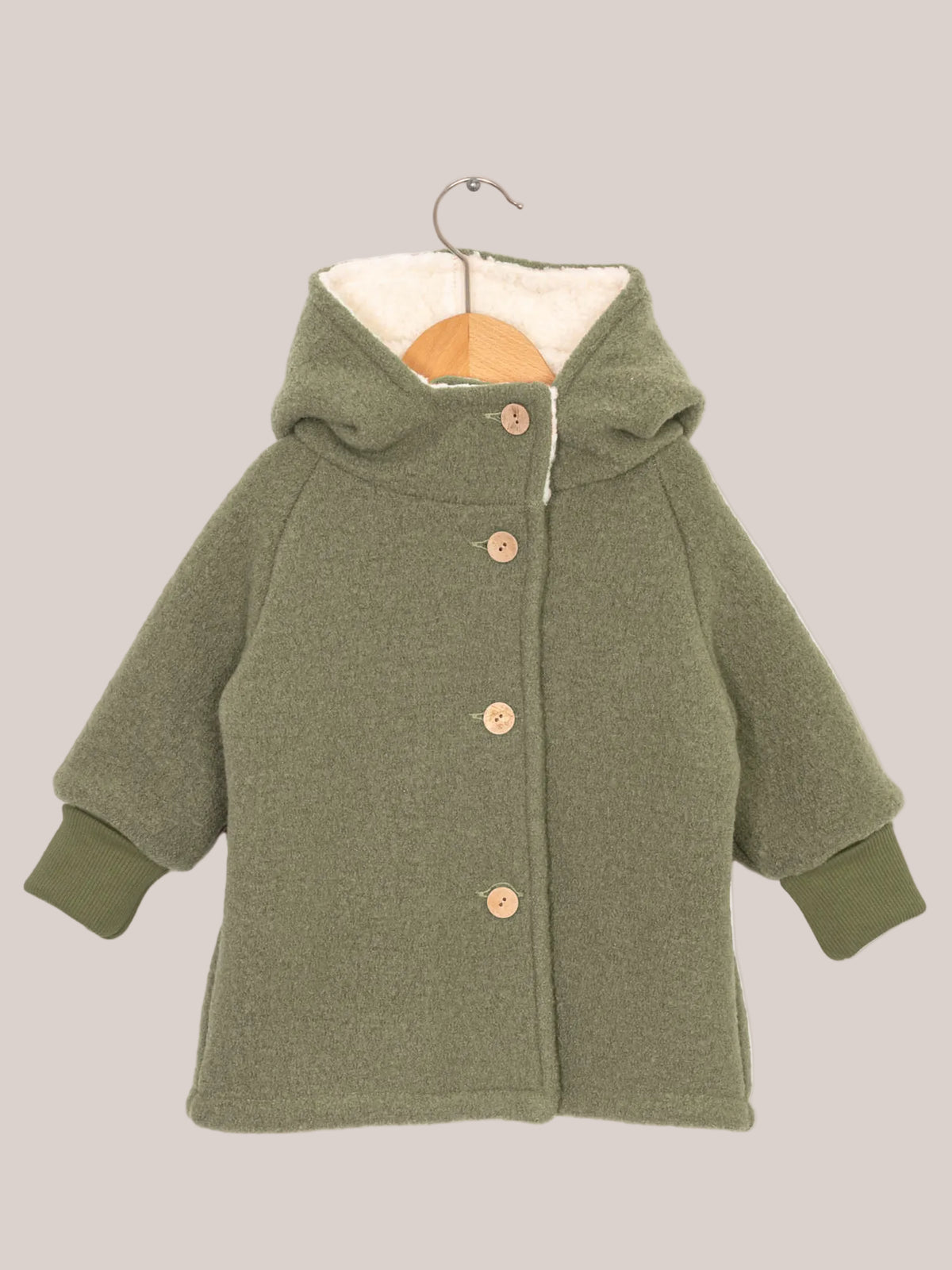 Teddy gnome jacket made of boiled wool – pistachio with white teddy lining, green knitted cuffs, button and hook, ideal for cold winter days and grows with the child. Boiled-wool jacket and winter jacket for children