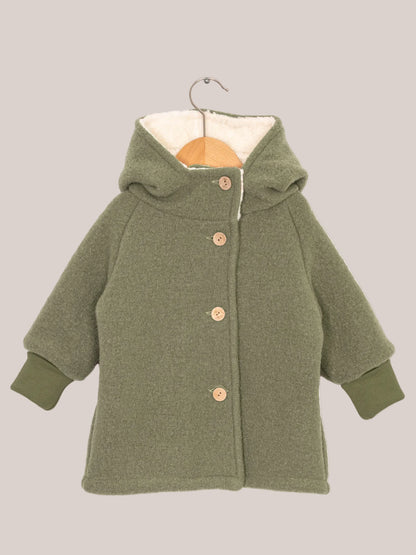 Teddy gnome jacket made of boiled wool – pistachio with white teddy lining, green knitted cuffs, button and hook, ideal for cold winter days and grows with the child. Boiled-wool jacket and winter jacket for children